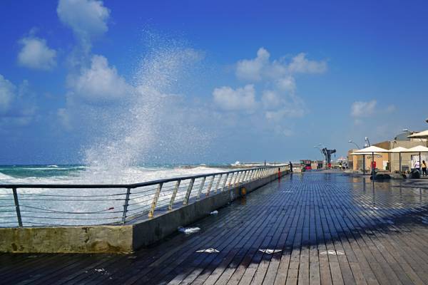 Waves splashing over the railings, Tel Aviv Old Port, Israel