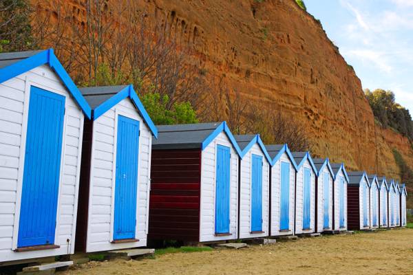 Blue shacks & brown cliff, Isle of Wight